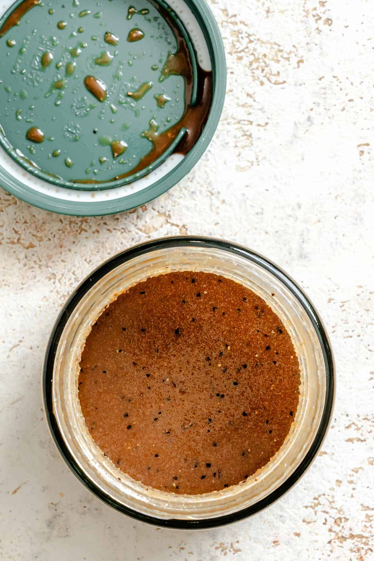 Process shot showing adding ingredients to a jar.