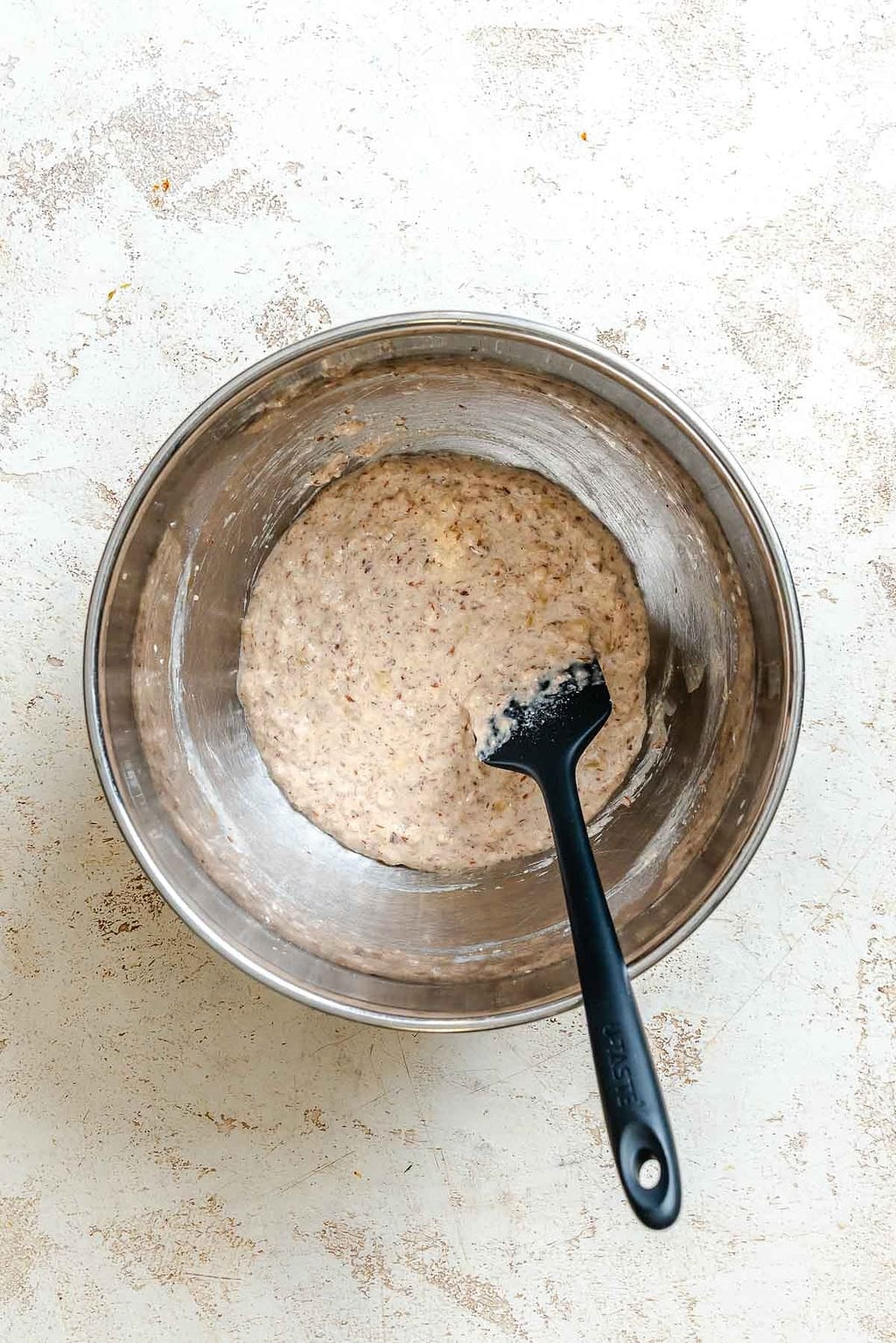 Process shot showing stirring ingredients in a bowl.