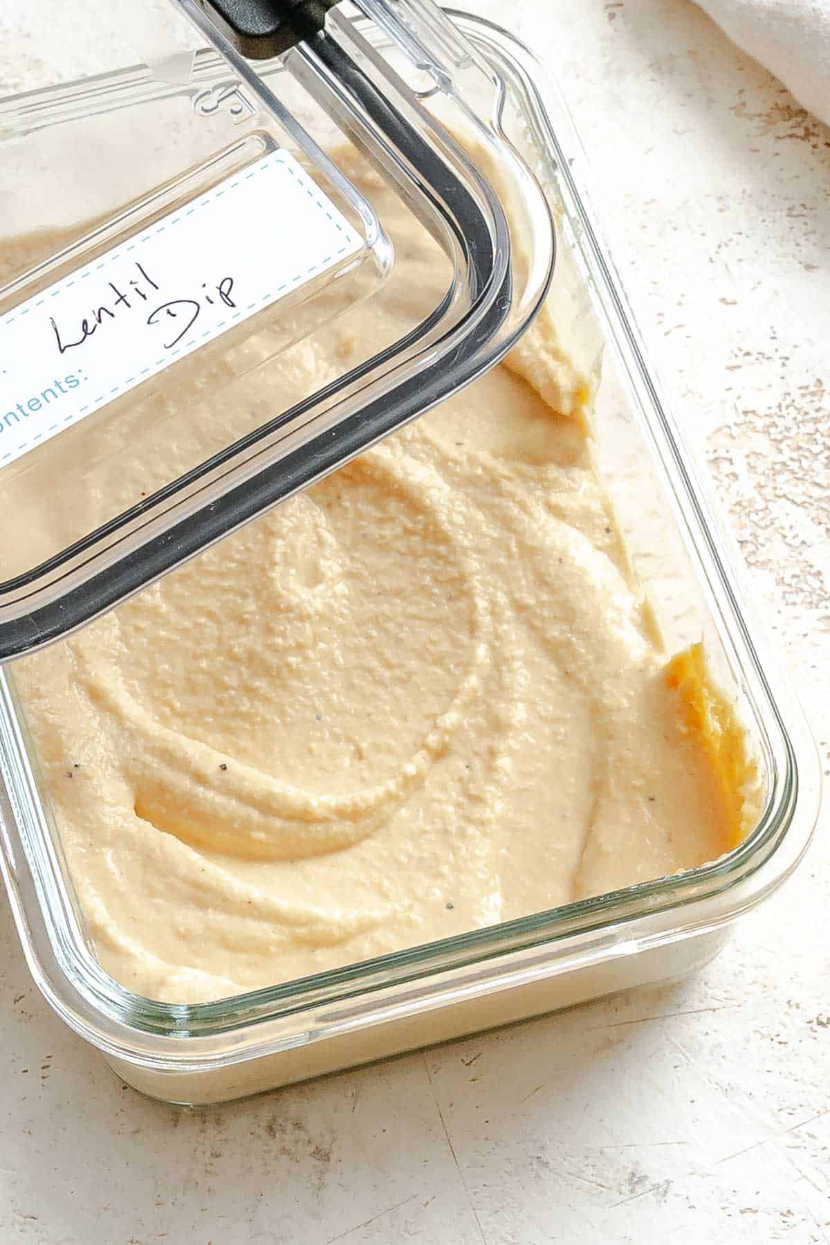 Completed Lentil Dip (Red Lentil Hummus) in a storage container.