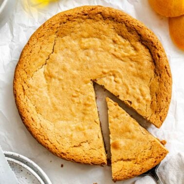 Completed Orange Olive Oil Cake on white surface.