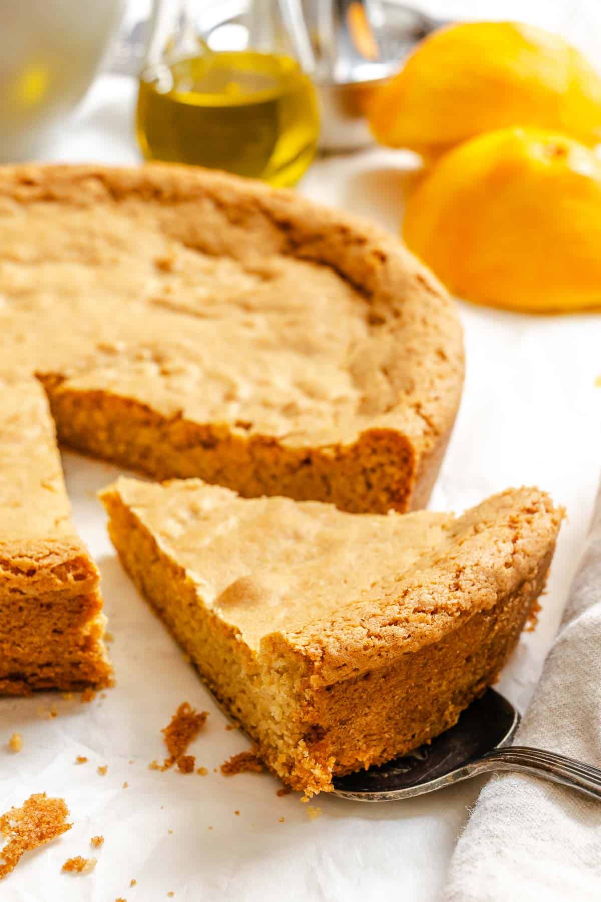 Completed Orange Olive Oil Cake on white surface.