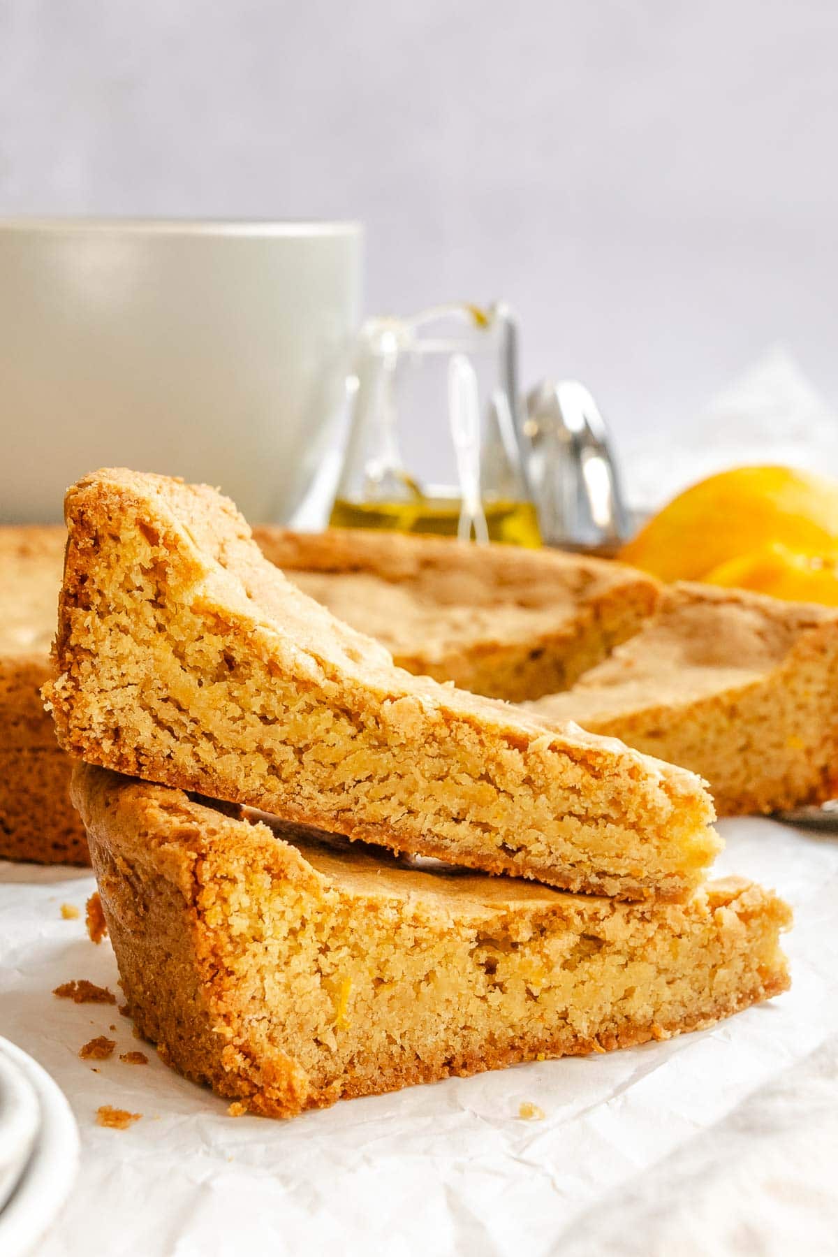 Completed Orange Olive Oil Cake pieces on white surface.