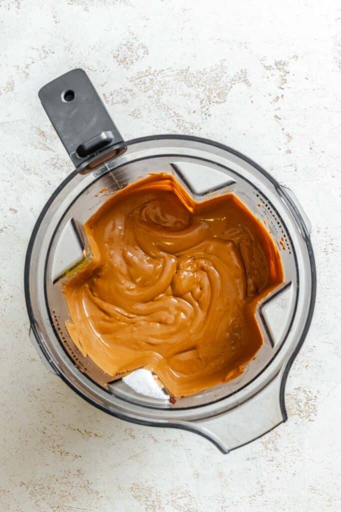 Process shot showing ingredients post being blended in a blender.