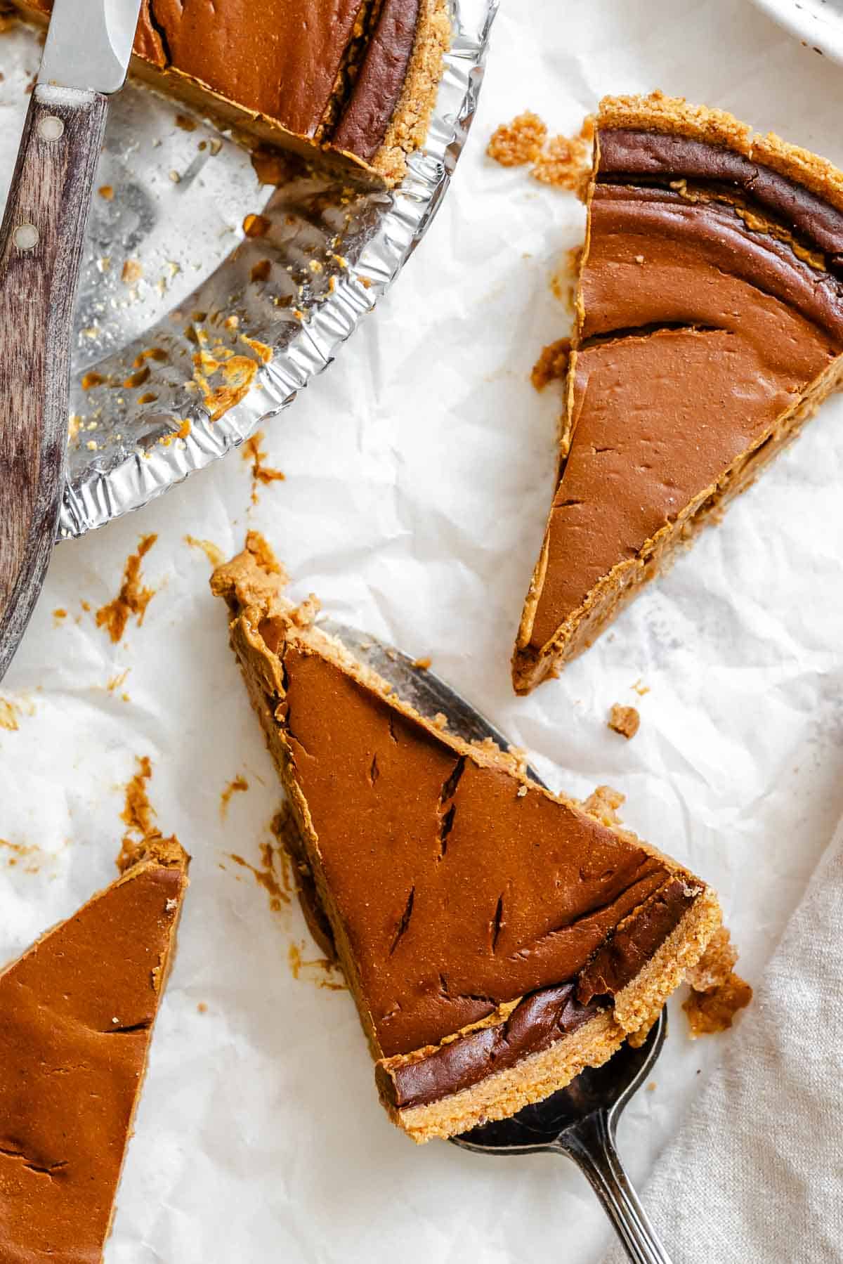 Completed Chocolate Pumpkin Pie pieces on a white surface.