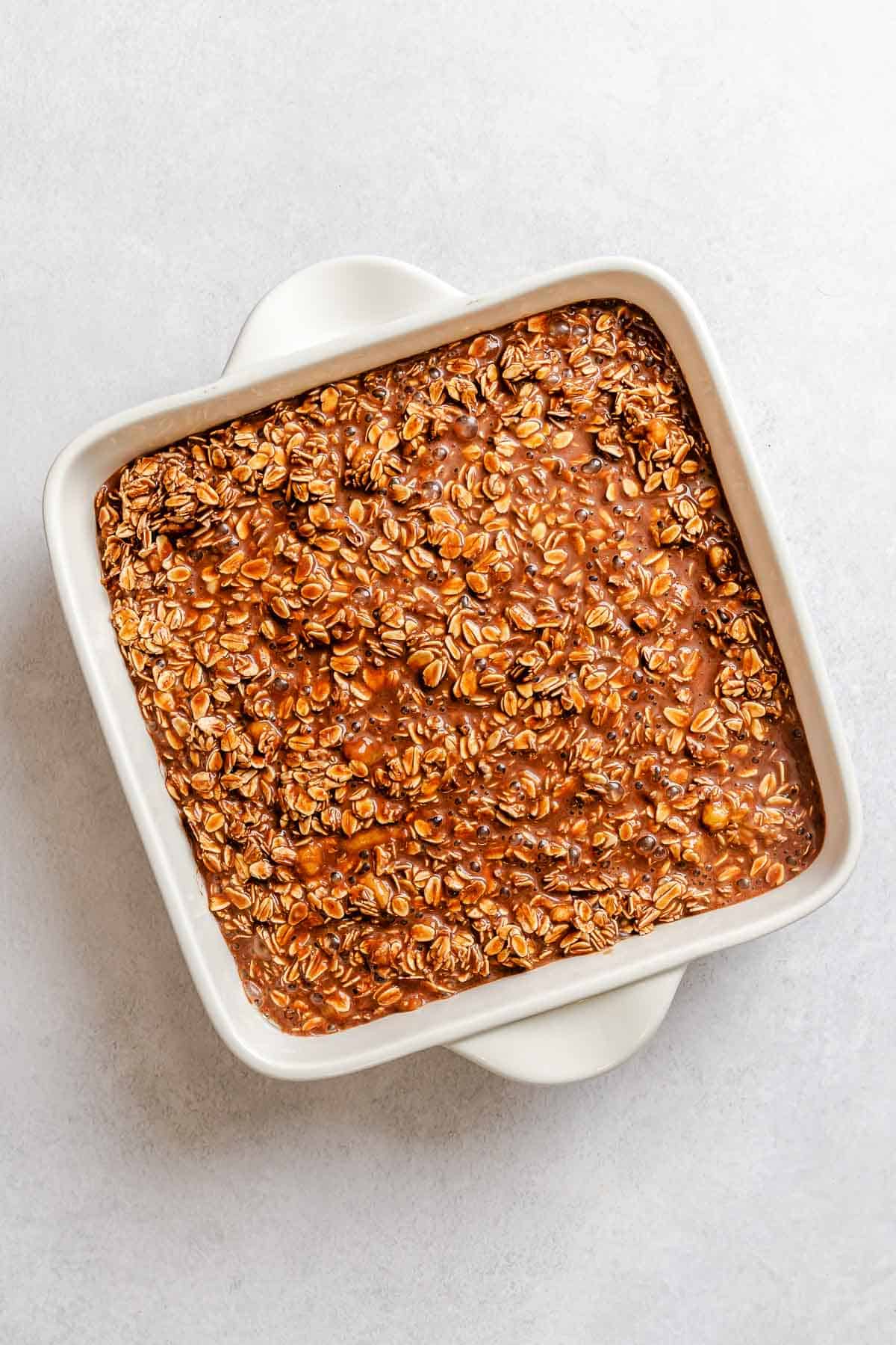 Process shot showing ingredients added to baking dish.