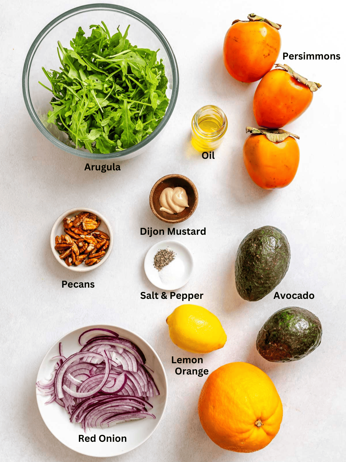 Ingredients for Persimmon Salad measured out on a white surface.