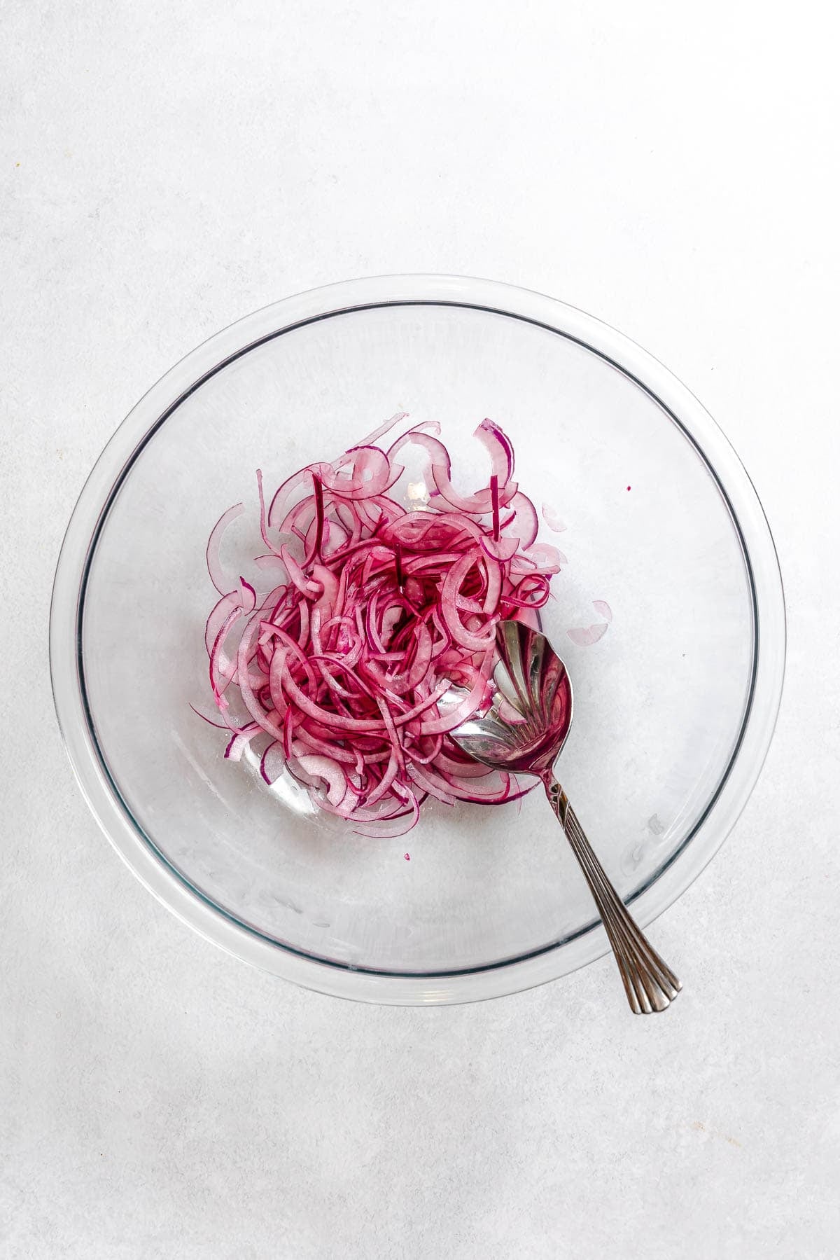 Process shot showing stirring ingredients together in a bowl.