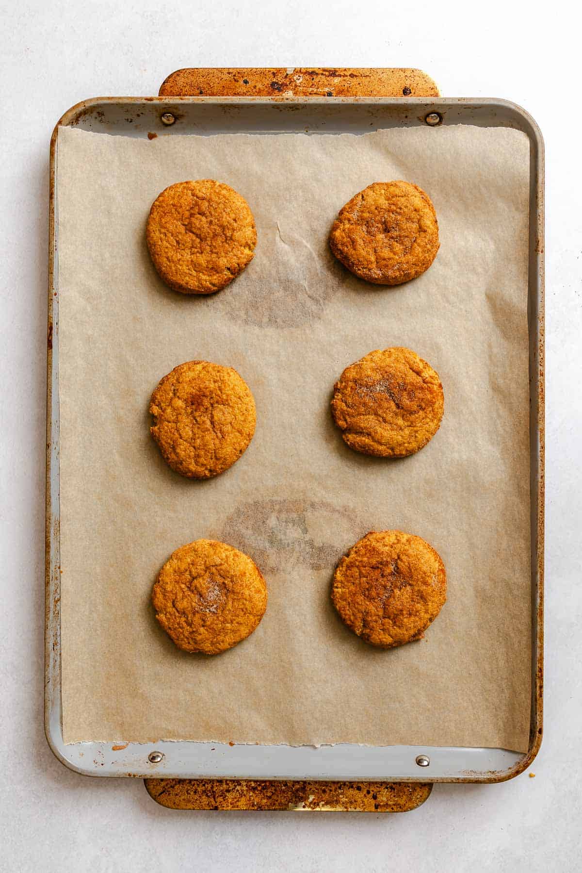 Process shot showing cookies on a baking sheet.