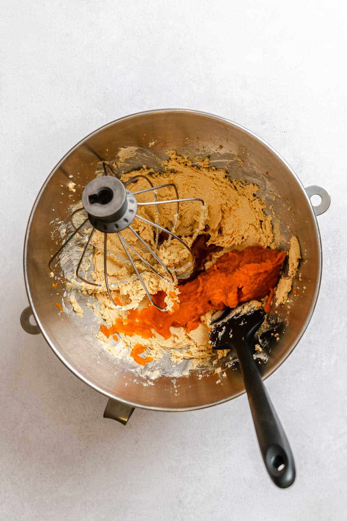 Process shot showing mixing ingredients in a bowl.