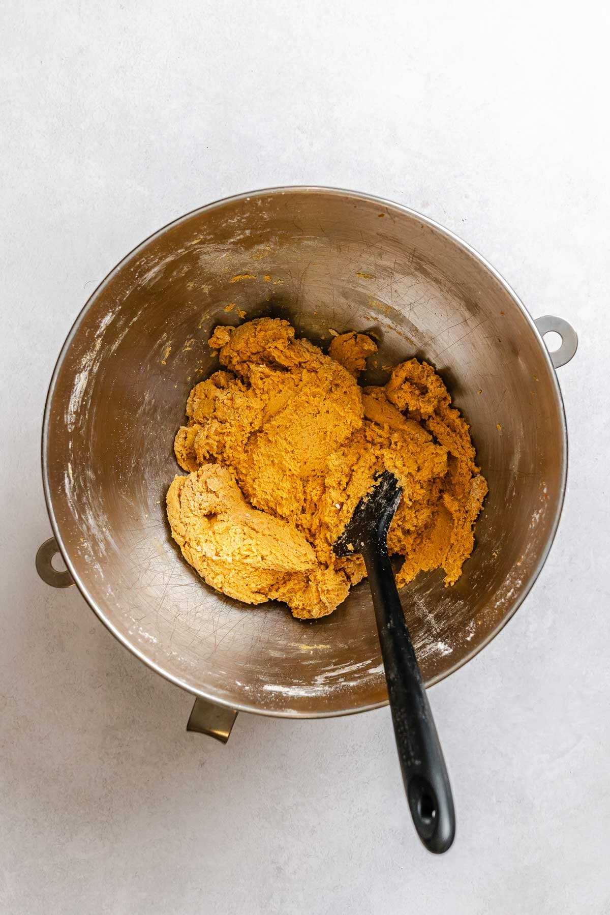 Process shot showing mixing ingredients in a bowl.