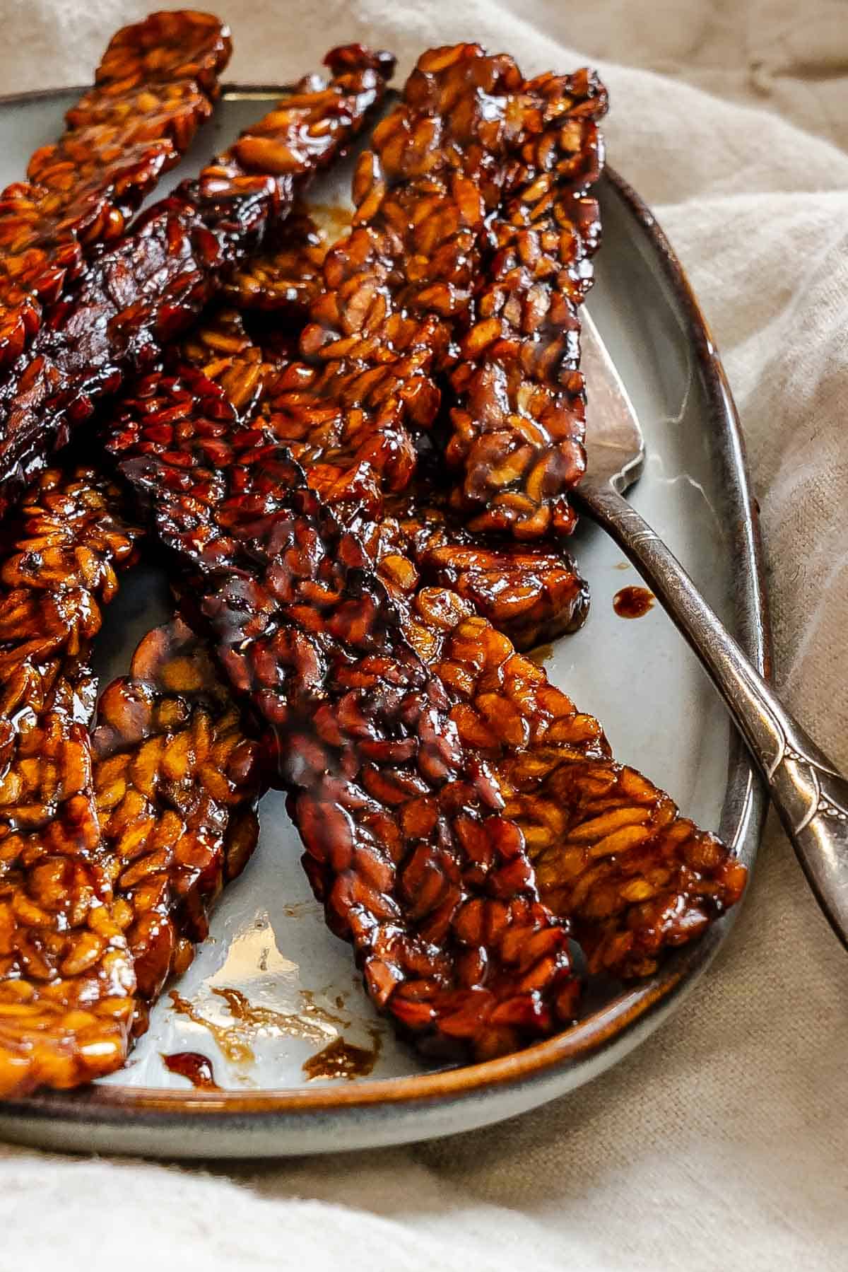 Completed Tempeh Bacon on a serving tray.