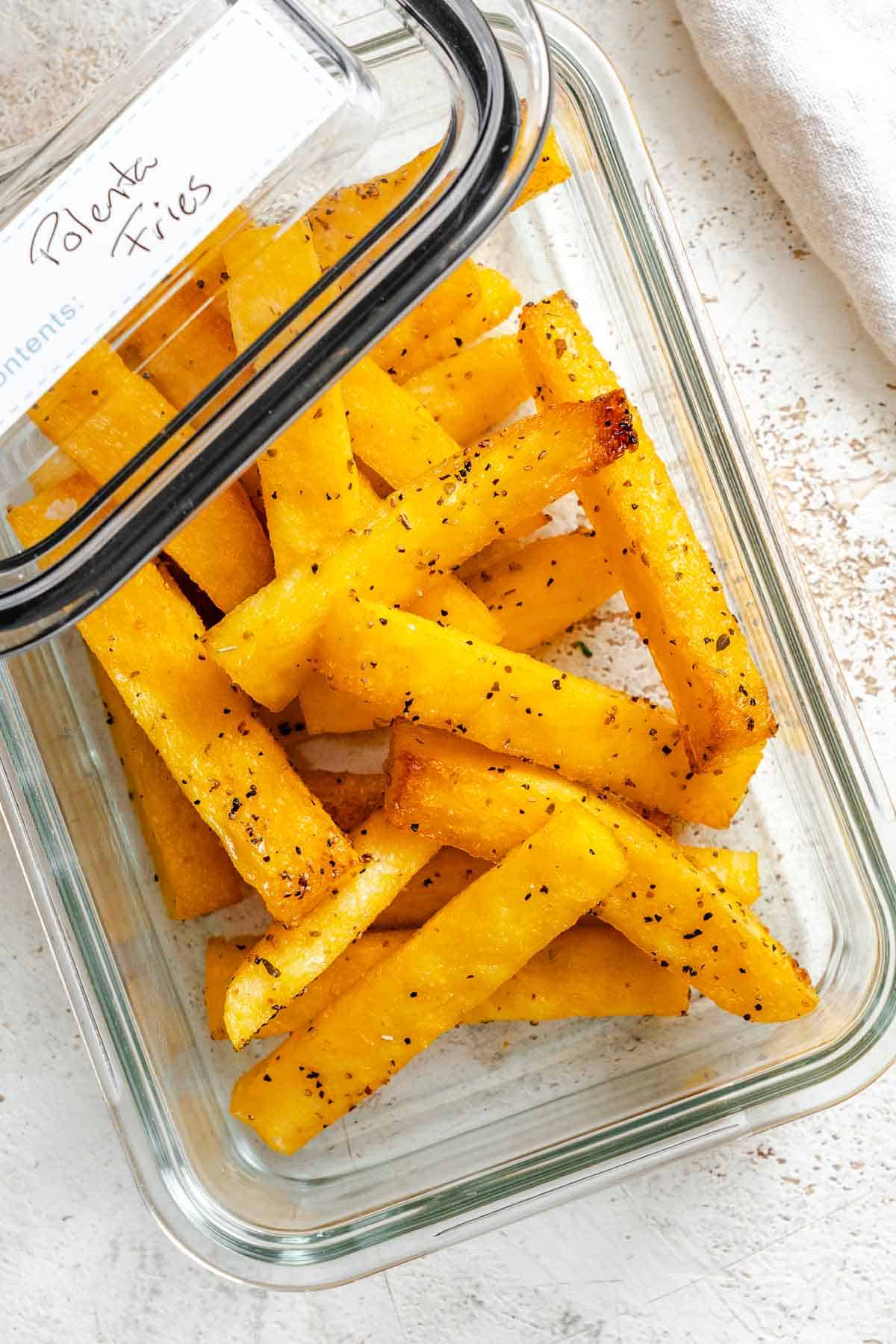 Completed Simple Polenta Fries in a storage container.