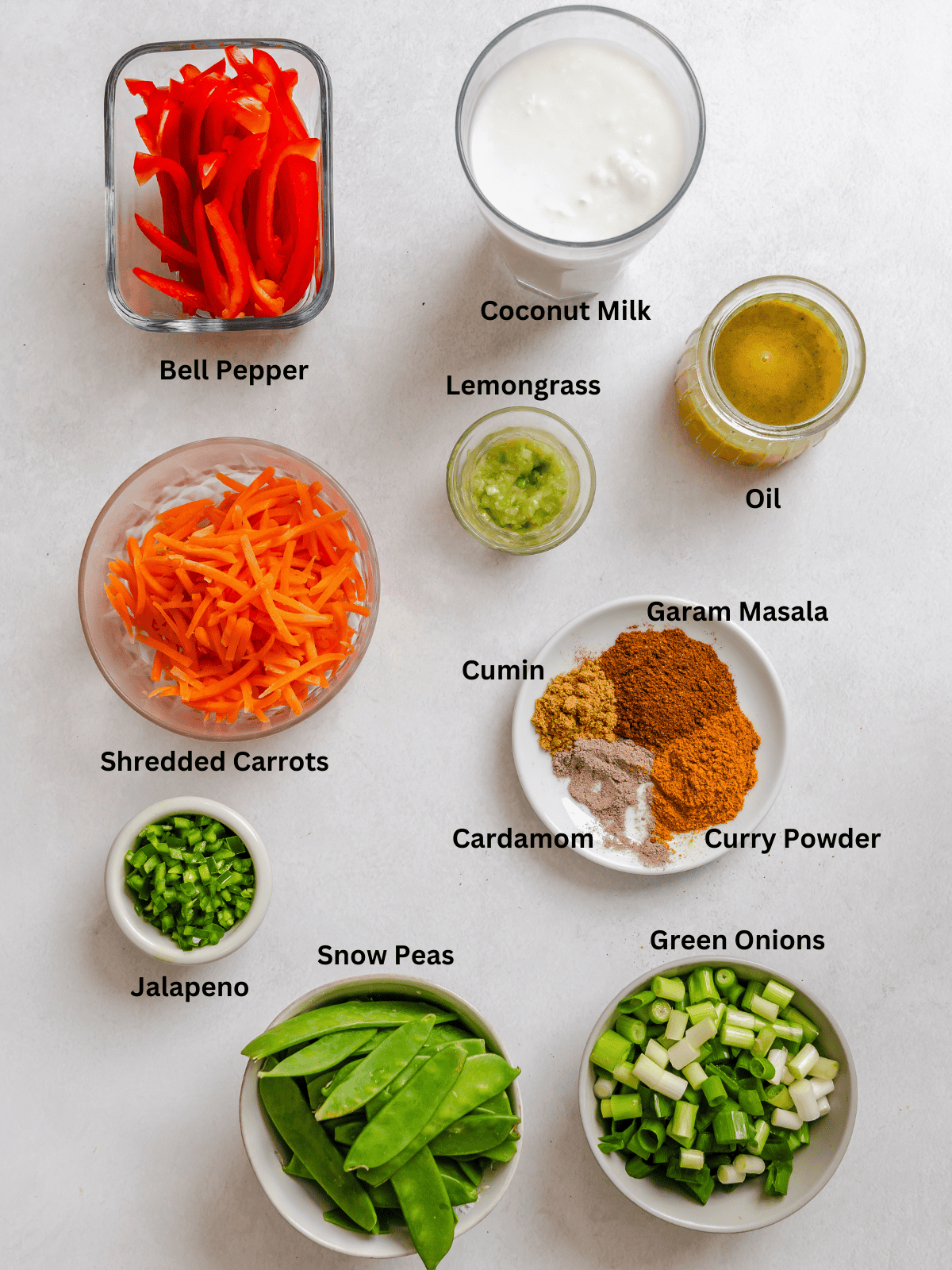 Ingredients for Easy Vegan Curry measured out on a white surface.