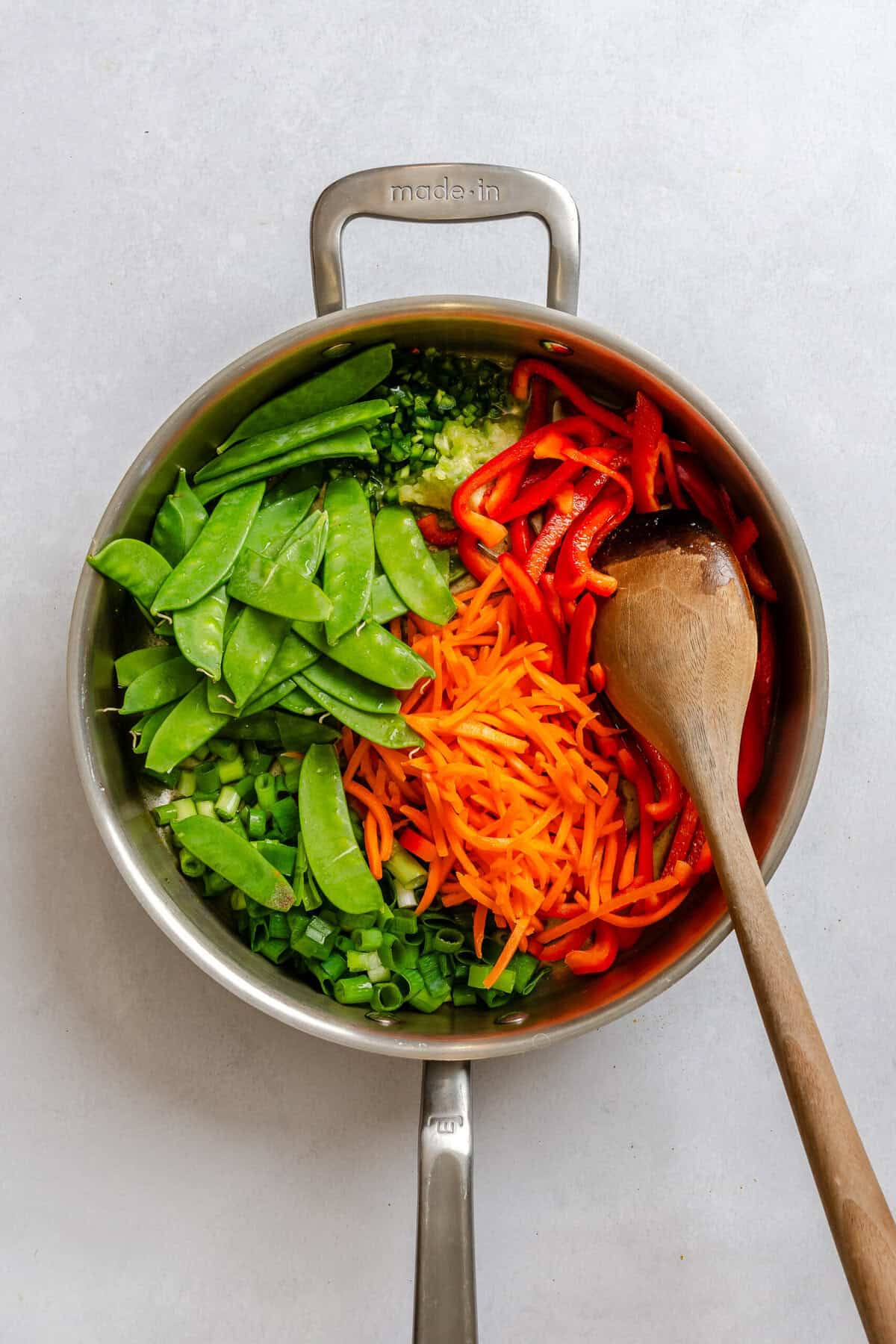 Process shot showing cooking ingredients in a pot.
