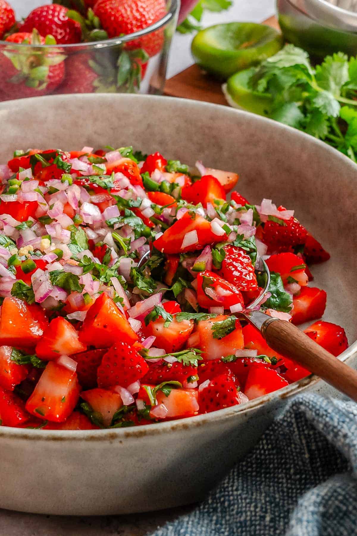 Completed strawberry salsa in a bowl.