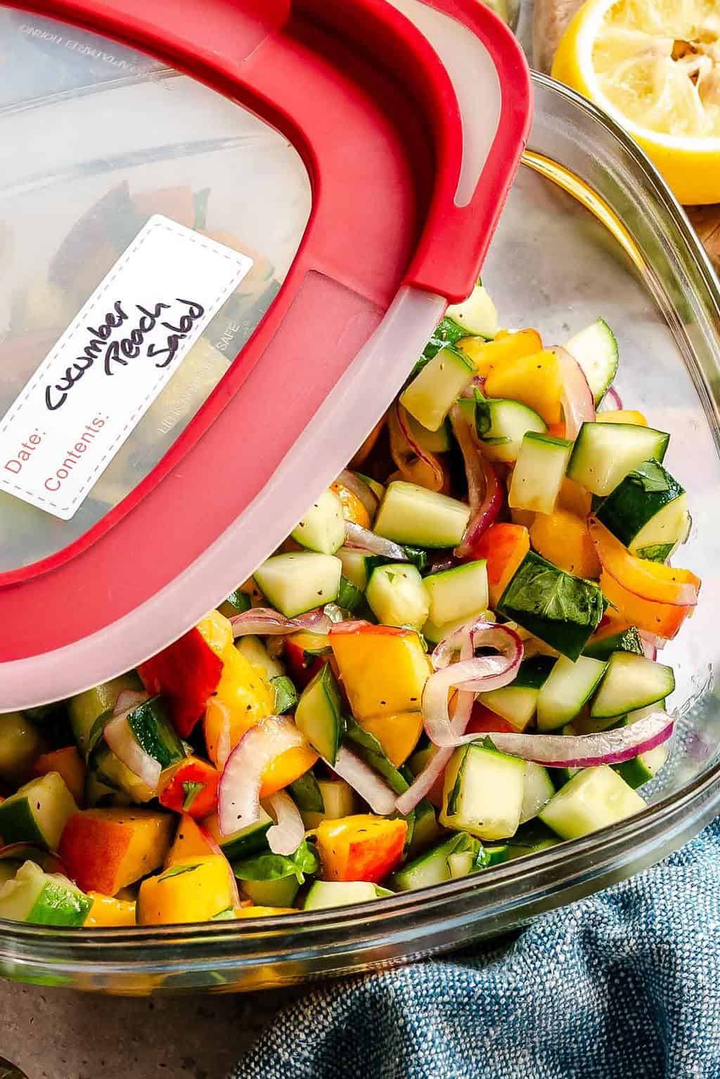 Completed Cucumber Peach Salad in a storage container.
