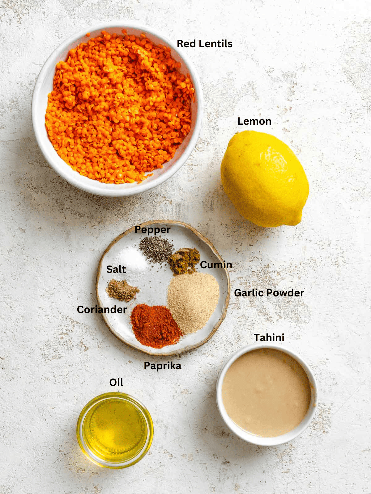 Ingredients for Lentil Dip (Red Lentil Hummus) measured out on a white surface.