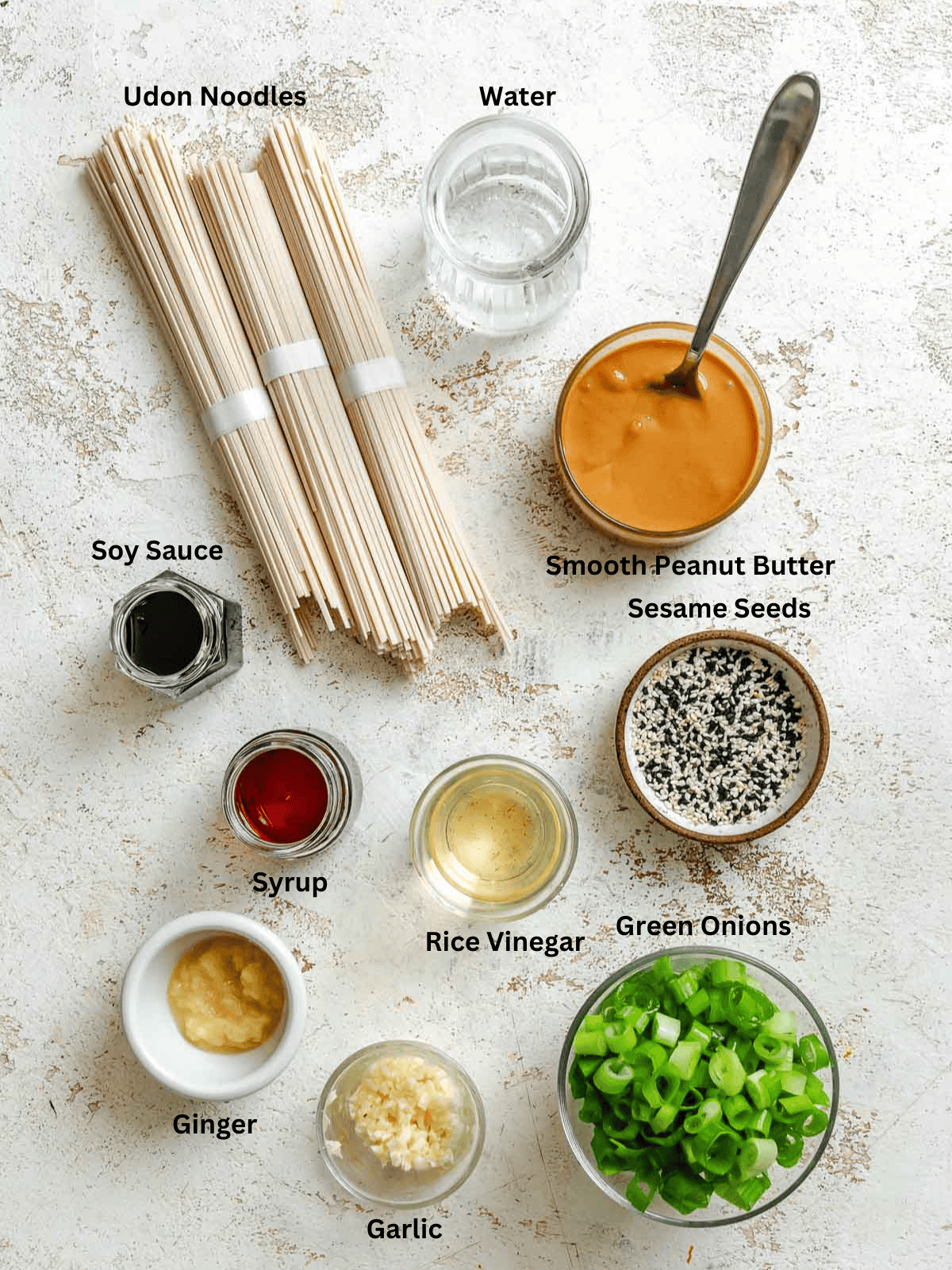 Ingredients for Quick Peanut Noodles measured out on a white surface. 