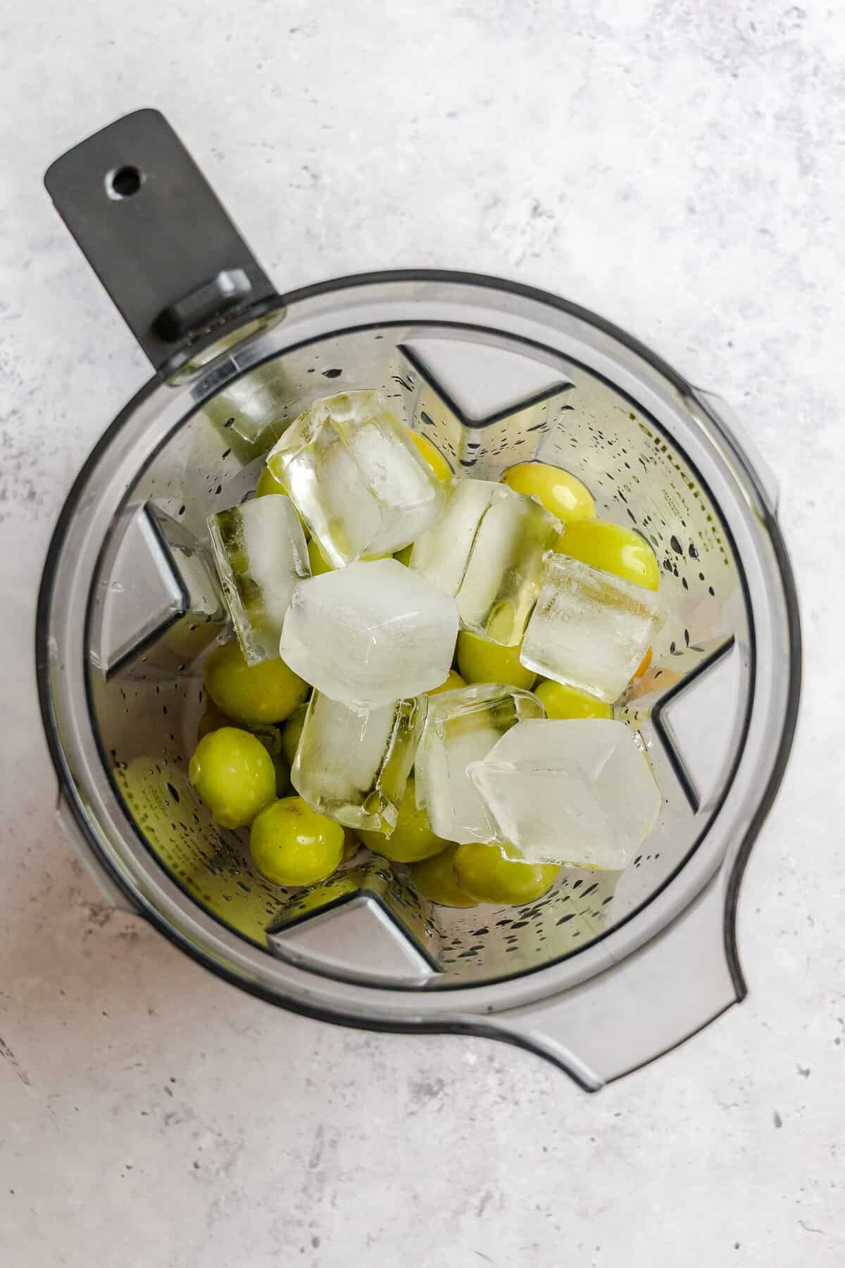 Process shot showing ingredients added to a blender.